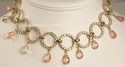 Feminine Rhinestone Loop Necklace with Dangling Pink Crystals