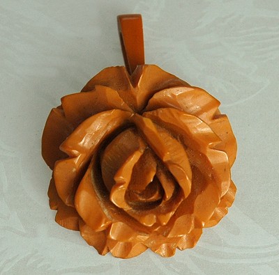 Vintage Deeply Carved Butterscotch BAKELITE Flower Pendant