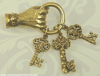 Enchanting Golden Hand Holding Ring of Ornate Keys Pin Signed JEANNE