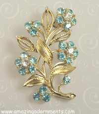 Pretty Blue and Clear Rhinestone Floral Spray Brooch Signed LISNER